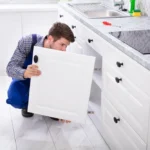 Adjusting a kitchen cupboard door