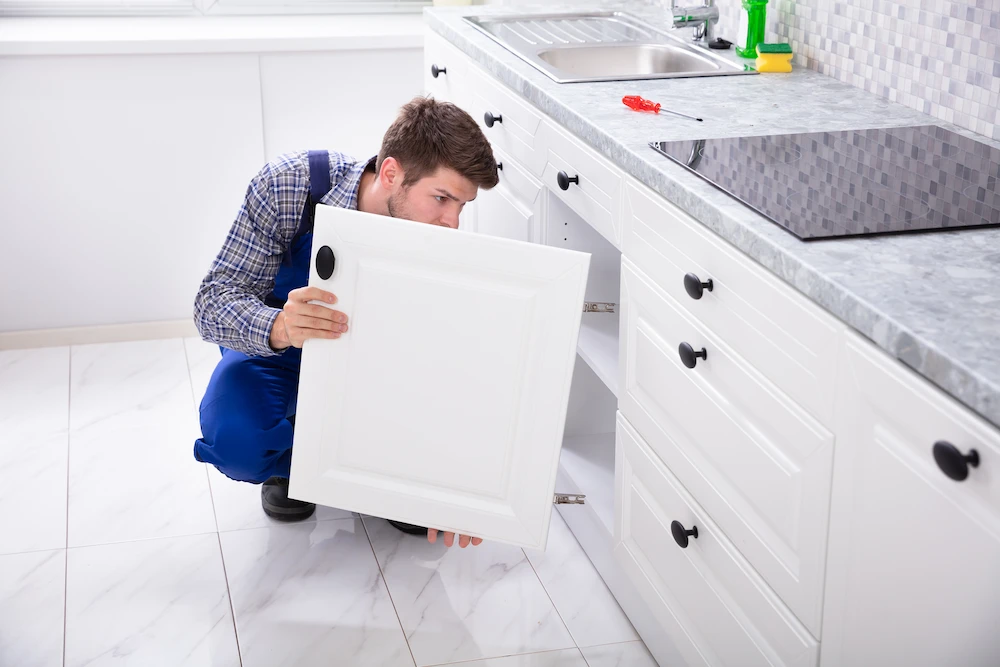 Adjusting a kitchen cupboard door
